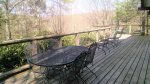 Large back deck off of dining area with ample outdoor seating